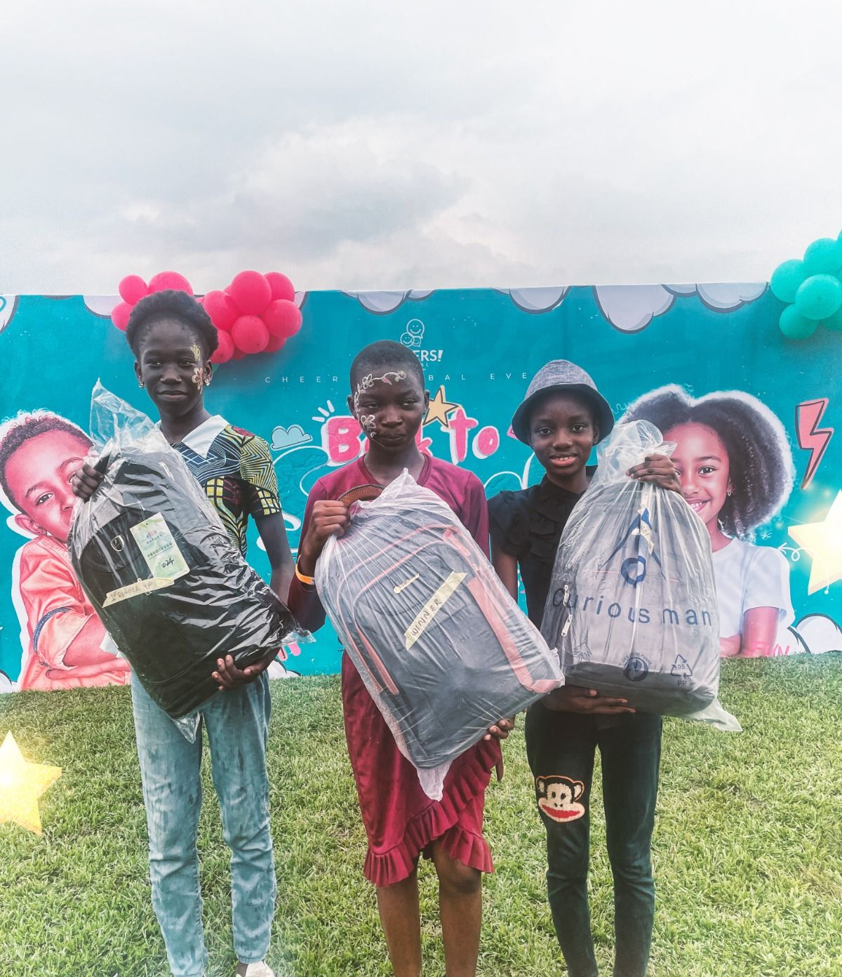 Children holding their new school bags
